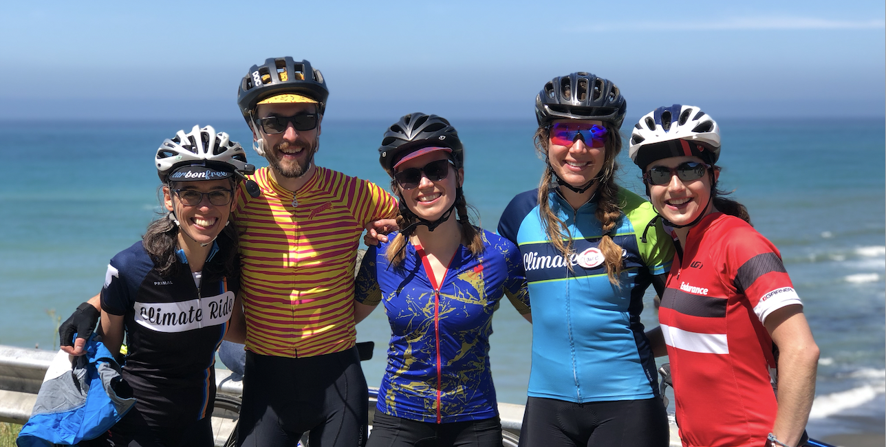 Smiling cyclists along the pacific coast