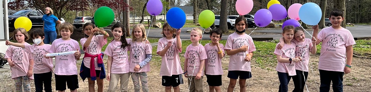 Group of Mini-THON students holding balloons
