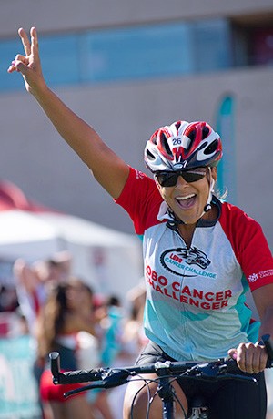 Elizabeth celebrates her finish at the Lobo Cancer Challenge
