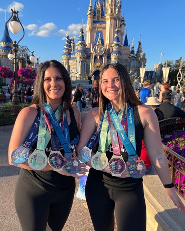 Jenson women at Disneyworld with event medals