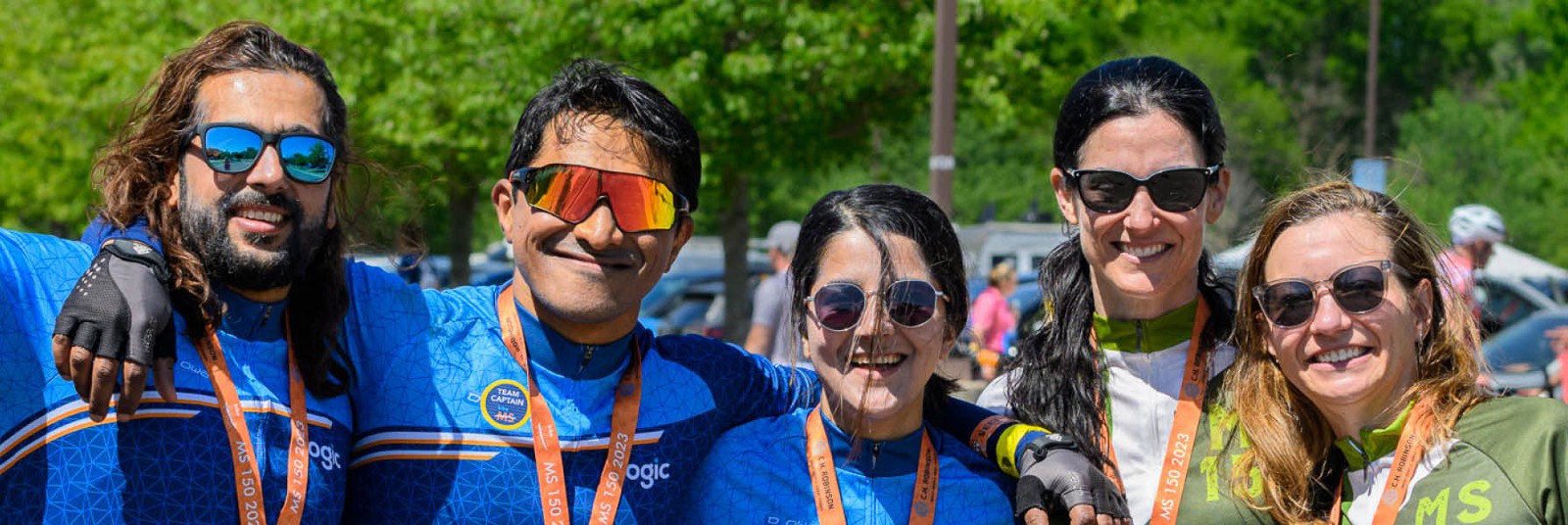 People Standing Together Smiling with Sunglasses On