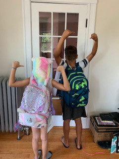 Two youth with their backpacks thanks to Backpack Heroes